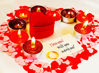 Image showing Ring and a card with marriage proposal with candles