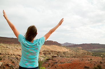 Image showing Woman with raised hands