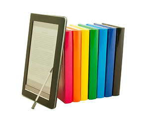 Image showing Stack of colorful books and electronic book reader