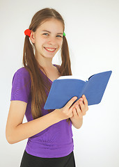 Image showing Teenage girl with a book