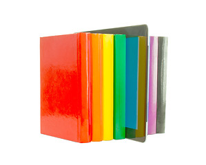Image showing Row of colorful books and electronic book reader over white back
