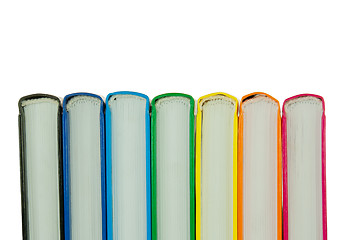 Image showing Row of colorful books' spines