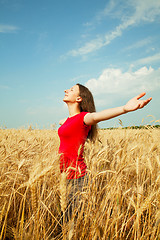 Image showing Teen girl staying at a wheat field