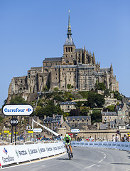 Image showing Cycling in Front of Le Mont Saint Michel