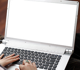 Image showing Young woman working on laptop