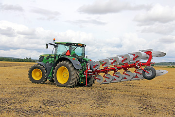 Image showing John Deere Tractor and Agrolux Plow