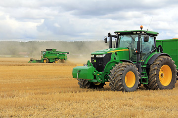 Image showing John Deere 7280R Agricultural Tractor and T560 Combine Harvester