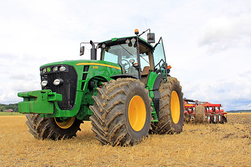 Image showing John Deere 8430 Agricultural Tractorand Cultivator
