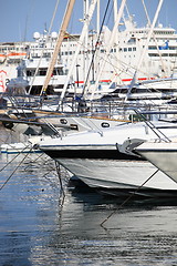 Image showing Luxury yachts with a cruise liner behind