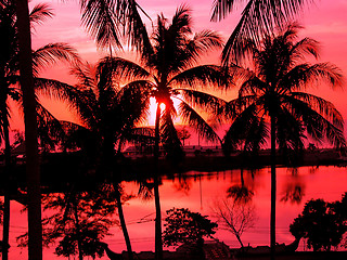 Image showing A beautiful sunset on the beach in Thailand with red sky.