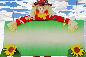 Image showing Colorful scarecrow at garden 