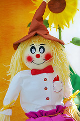 Image showing Colorful scarecrow at garden of paper