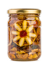 Image showing Glass jar filled with honey, nuts and fruits