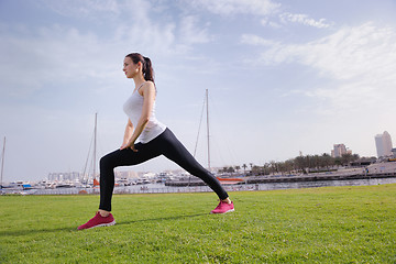 Image showing Young beautiful  woman jogging  on morning