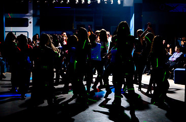 Image showing Silhouettes of dancing teenagers