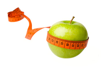 Image showing Green apple and measuring tape