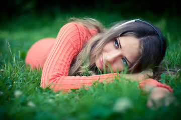 Image showing Relaxed young woman listening music