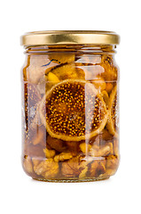 Image showing Glass jar filled with honey, nuts and fruits