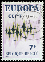 Image showing Stamp printed in Belgium showing sparkling stars on a white background