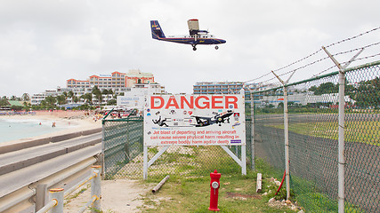 Image showing PRINCESS JULIANA AIRPORT, ST MARTIN - JULY 19, 2013: Warning sig