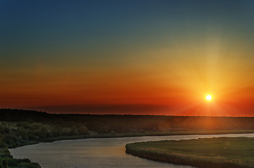 Image showing red sunset over river