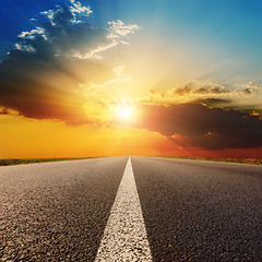 Image showing asphalt road under sunset with clouds