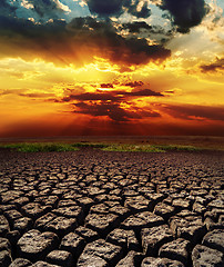 Image showing dramatic sunset over drought land