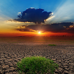 Image showing dramatic sunset over barren earth