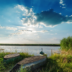 Image showing sunset over river with boats