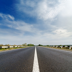 Image showing road closeup under cloudy blue sky