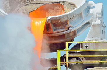 Image showing The molten slag is poured from a cup 