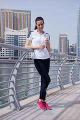 Image showing Young beautiful  woman jogging  on morning