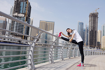 Image showing Young beautiful  woman jogging  on morning