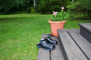 Image showing Clogs at a stair