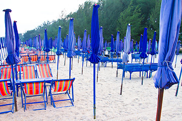 Image showing Beach chair and colorful umbrella on the beach. Thailand