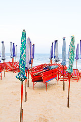 Image showing Beach chair and colorful umbrella on the beach. Thailand