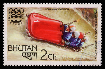 Image showing Stamp printed in Bhutan shows four man bobsleigh at the Olympic Winter Games in Innsbruck