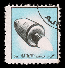 Image showing Stamp printed in emirate Ajman show spaceship