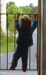 Image showing Little boy in window