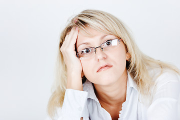 Image showing Tired of attractive young blond woman in glasses