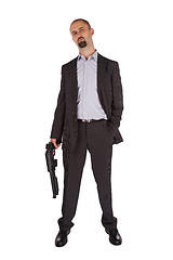 Image showing Mafia man is holding a shotgun