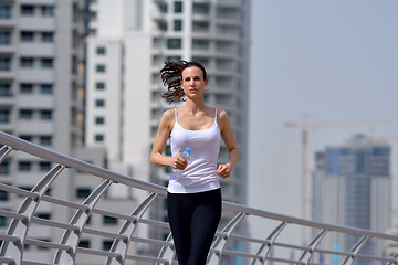 Image showing woman jogging at morning