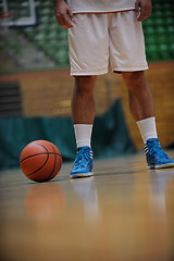 Image showing basketball ball and net on black background