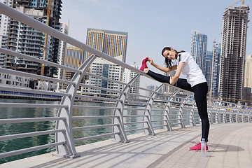 Image showing Young beautiful  woman jogging  on morning