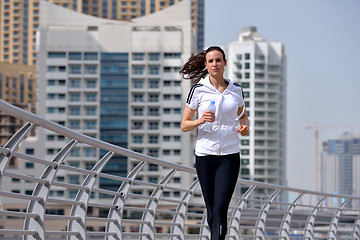 Image showing woman jogging at morning