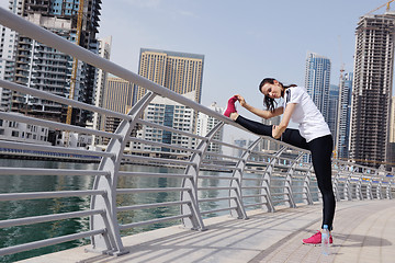 Image showing Young beautiful  woman jogging  on morning