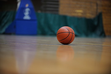 Image showing basketball ball and net on black background