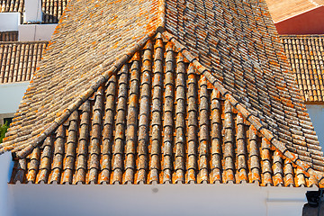 Image showing The roof with tiles in a sunny day