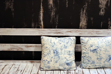 Image showing Cushions on a wooden seat