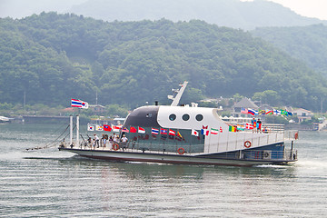 Image showing NAMISEOM - JUNE 15: Visitors arrive in Nami Island by ferry on J